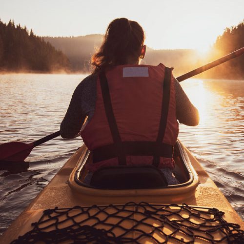 purely inspired features woman in kayak