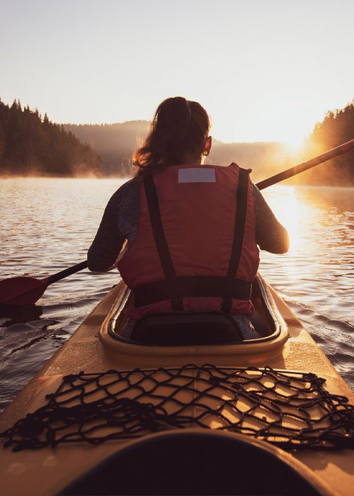 purely inspired features woman in kayak